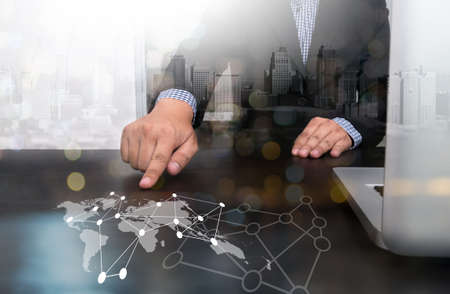 businessman hand working with modern technology and digital layer effect as business strategy conceptの写真素材