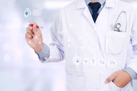 Medicine doctor hand working with modern computer interface as medical network conceptの写真素材