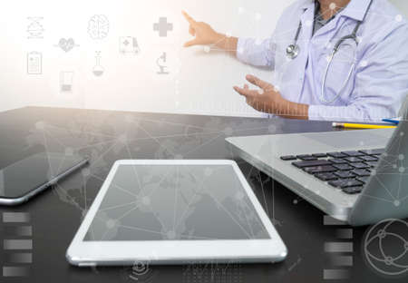 Medicine doctor hand working with modern digital tablet with computer interface as medical network...