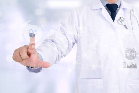 Medicine doctor hand working with modern computer interface as medical concept with abstract blurry bokeh backgroundの写真素材