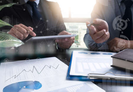 Businessman making presentation and business strategy digital layer effect at the office as concept