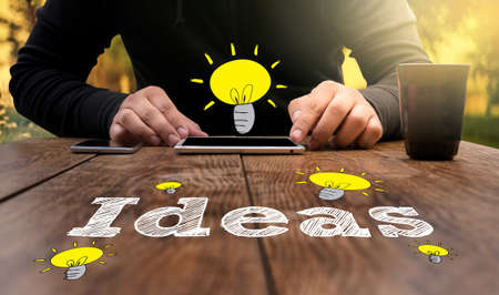 flare sun, Cropped image male freelancer sitting at the table with cup of coffee, business touch Ideas Conceptsの写真素材