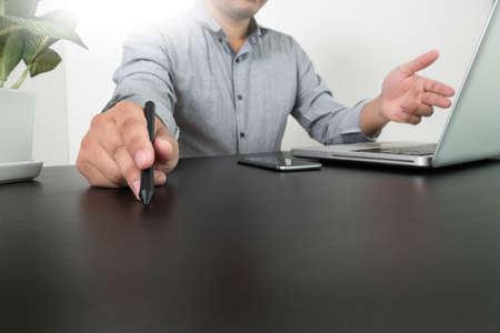 businessman hand working with new modern computer and smart phone and business strategy on concept, copy spaceの写真素材