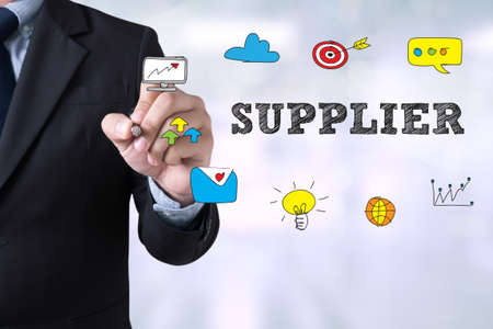 Businessman drawing suppliers concept on  Page concept on blurred abstract backgroundの写真素材