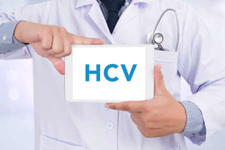 Diagnosis - HCV CONCEPT ,Doctor holding  digital tabletの写真素材