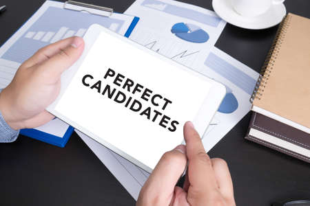 PERFECT CANDIDATES CONCEPT  Modern people doing business, graphs and charts and touch-padの写真素材