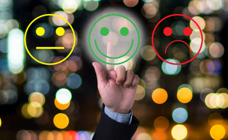 business man select happy on satisfaction evaluation?  blurred abstract backgroundの写真素材
