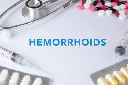 HEMORRHOIDS Text, On Background of Medicaments Composition, Stethoscope, mix therapy drugs doctor flu antibiotic pharmacy medicine medicalの写真素材