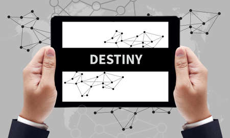 DESTINY CONCEPT on the tablet pc screen by businessman hands, top viewの写真素材