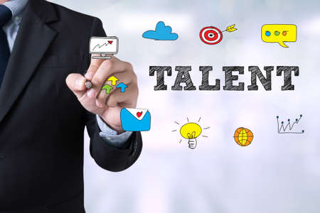 TALENT CONCEPT Businessman drawing Landing Page on blurred abstract backgroundの写真素材