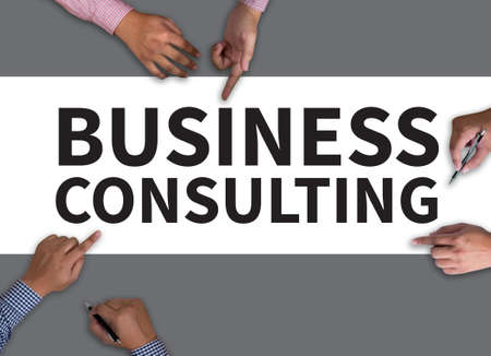 BUSINESS CONSULTING CONCEPT vintage blackboard with wooden frame on white background.の写真素材