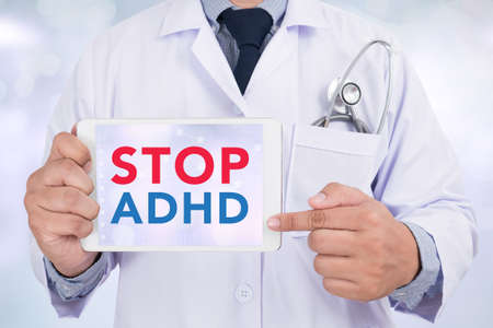 STOP ADHD Doctor holding  digital tabletの写真素材