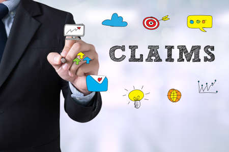 CLAIMS CONCEPT Businessman drawing Landing Page on blurred abstract backgroundの写真素材