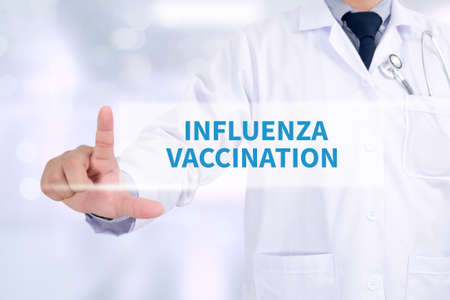 INFLUENZA VACCINATION CONCEPT Medicine doctor working with computer interface as medicalの写真素材
