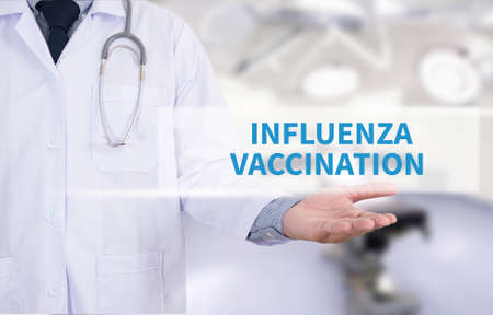 INFLUENZA VACCINATION CONCEPT Medicine doctor hand workingの写真素材