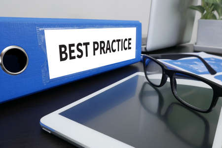 BEST PRACTICE CONCEPT      Office folder on Desktop on table with Office Supplies.の写真素材