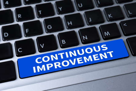 CONTINUOUS IMPROVEMENT a message on keyboardの写真素材