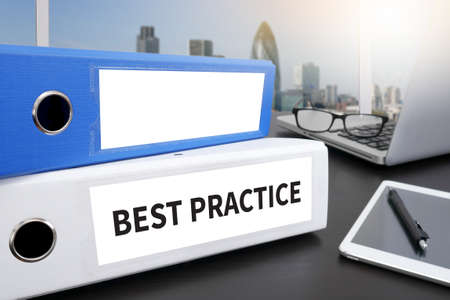 BEST PRACTICE CONCEPT      Office folder on Desktop on table with Office Supplies.の写真素材