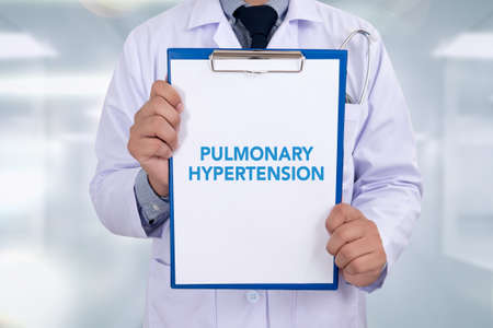 PULMONARY HYPERTENSION Portrait of a doctor writing a prescriptionの写真素材