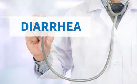 DIARRHEA Medicine doctor hand working on virtual screenの写真素材