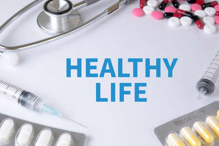 HEALTHY LIFE Text, On Background of Medicaments Composition, Stethoscope, mix therapy drugs doctor flu antibiotic pharmacy medicine medicalの写真素材