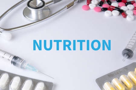NUTRITION Text, On Background of Medicaments Composition, Stethoscope, mix therapy drugs doctor flu antibiotic pharmacy medicine medicalの写真素材