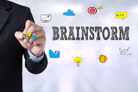 BRAINSTORM Businessman drawing Landing Page on blurred abstract backgroundの写真素材