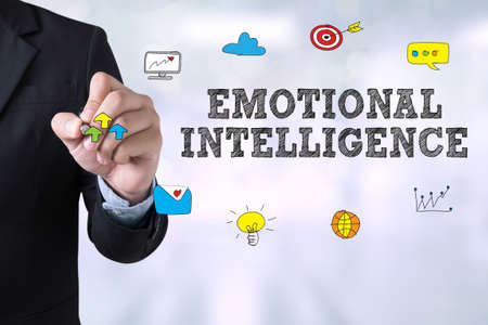 EMOTIONAL INTELLIGENCE Businessman drawing Landing Page on blurred abstract background EMOTIONAL INTELLIGENCE Businessman drawing Landing Page on blurred abstract background