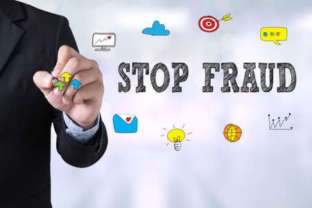 STOP FRAUD Businessman drawing Landing Page on blurred abstract backgroundの写真素材