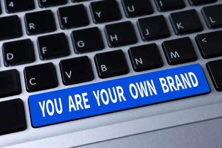 YOU ARE YOUR OWN BRAND a message on keyboardの写真素材