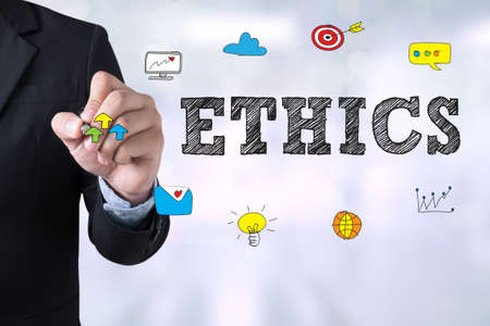 ETHICS Businessman drawing Landing Page on blurred abstract backgroundの写真素材
