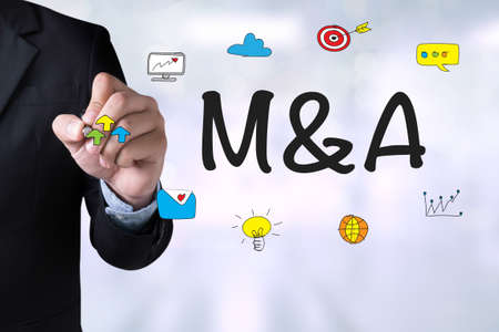 M&A (MERGERS AND ACQUISITIONS) and Businessman drawing Landing Page on blackboardの写真素材