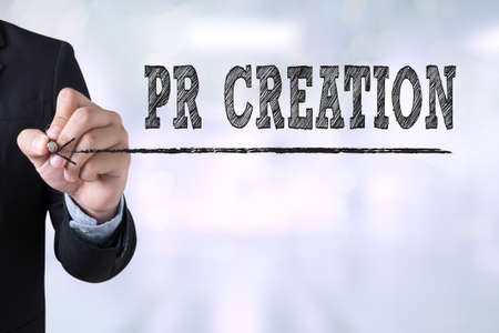 PR CREATION Businessman drawing Landing Page on blurred abstract backgroundの写真素材