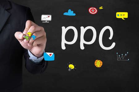 PPC - Pay Per Click concept Businessman drawing Landing Page on blurred abstract backgroundの写真素材