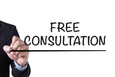 FREE CONSULTATION        Businessman hand writing with black marker on white backgroundの写真素材