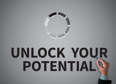 UNLOCK YOUR POTENTIAL businessman work on white broad, top view