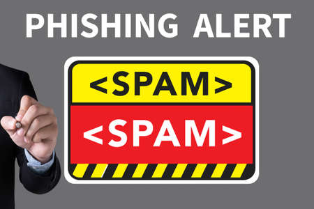 PHISHING ALERT and Businessman drawing Landing Page on white backgroundの写真素材