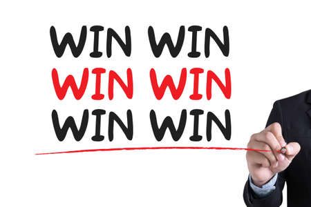 WIN WIN  Businessman hand writing with black marker on white backgroundの写真素材