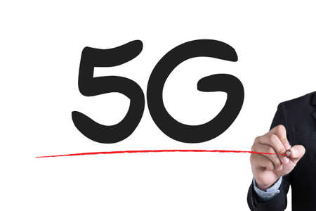 5G Businessman hand writing with black marker on white background