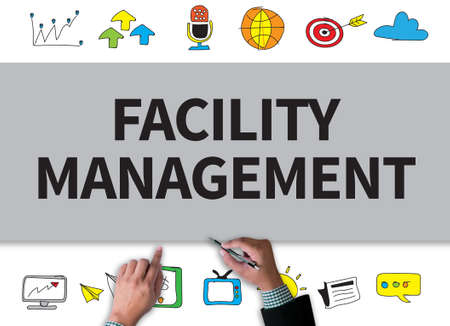 FACILITY MANAGEMENT businessman work on white broad, top viewの写真素材