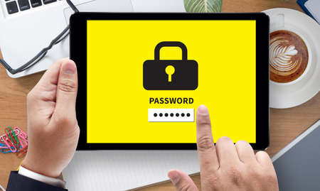 PASSWORD 123456, on the tablet pc screen held by businessman hands - online, top viewの写真素材
