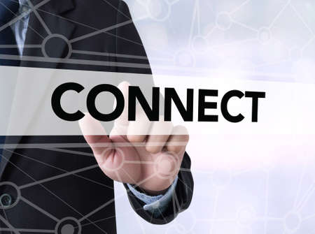 CONNECT  (Connected Communication Connection Media) Businessman touching a touch screen on blurred...