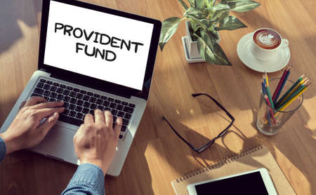 PROVIDENT FUND man hand on table Business, coffee, Split toneの写真素材