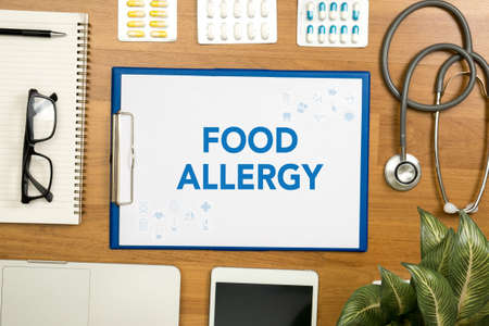 FOOD ALLERGY Professional doctor use computer and medical equipment all around, desktop top viewの写真素材