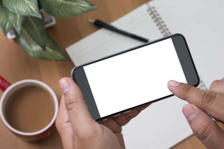 Isolated male hand holding a phone with white screen