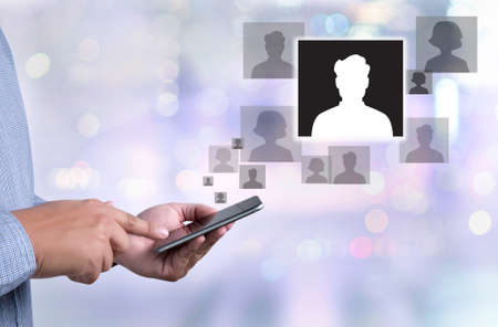 RESOURCES Human Resources Interview Recruitment Job  person holding a smartphone on blurred cityscape backgroundの写真素材