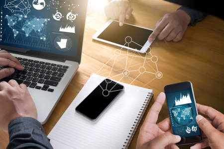 double exposure of business man hand working on laptop computer on wooden desk with social media network diagram topの写真素材