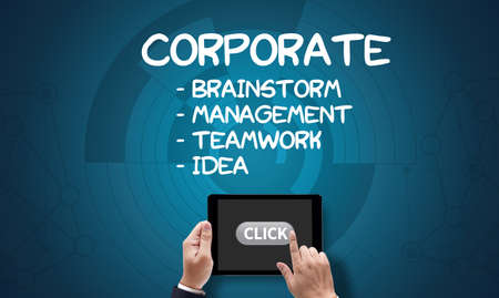 CORPORATE Process Business Strategy Management  Teamwork and CORPORATE, on the tablet pc screen held by businessman hands - online, top viewの写真素材