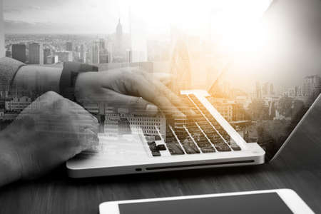 Business Digital businessman hand working on laptop computer and business strategy