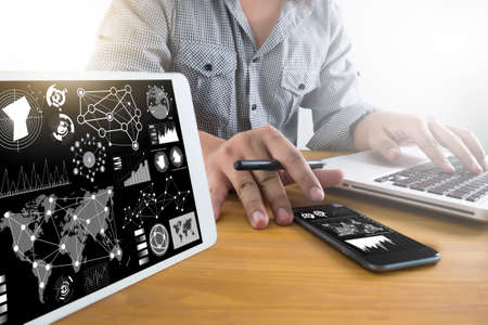 Professional investor working Business team work.  Finance task. laptop computer smart phone using laptop screen,Silhouette and filter sunの写真素材